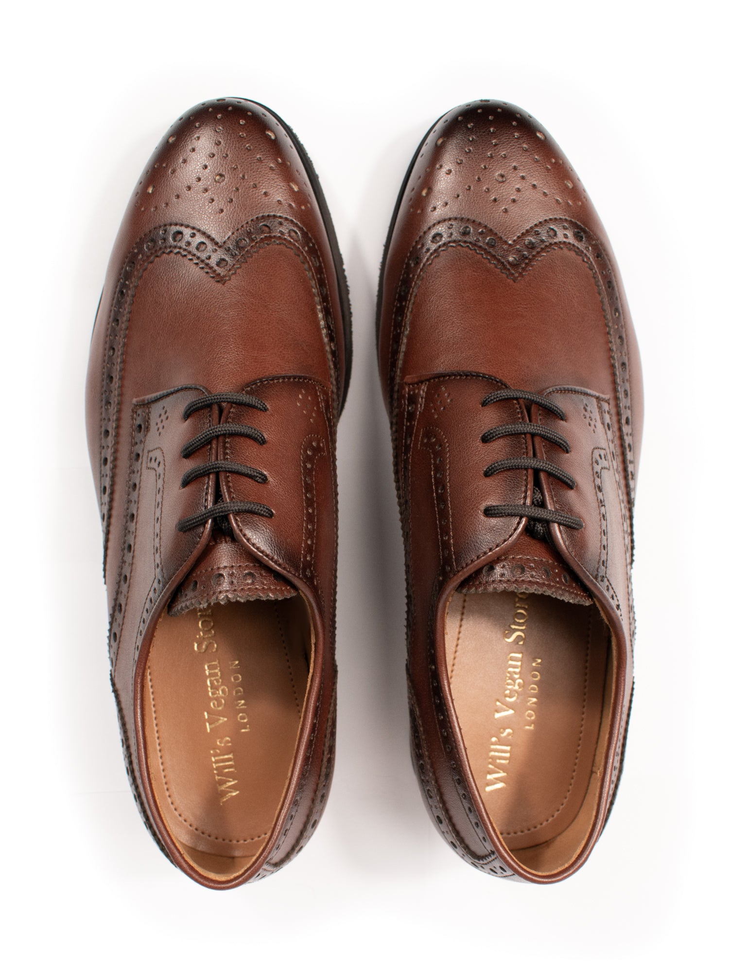 Pair of men’s vegan Goodyear Welt Oxford Brogues in rich chestnut leather, viewed from above to show clean silhouette and recycled laces.