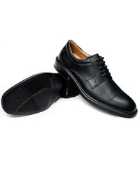 Pair of black vegan waterproof Derby shoes showing grip outsole and smart square toe design